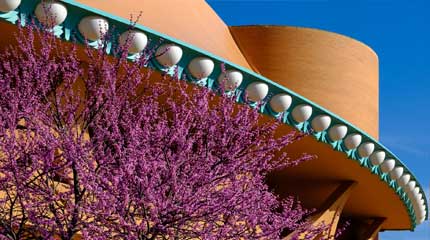 The Bartlesville Community Center with budding tree