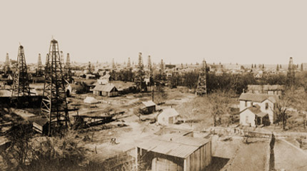 Pre-1900s photograph of Bartlesville with oil wells stretching to the horizon